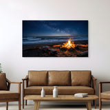 Beach scene with bonfire on wall above brown sofa in living room.
