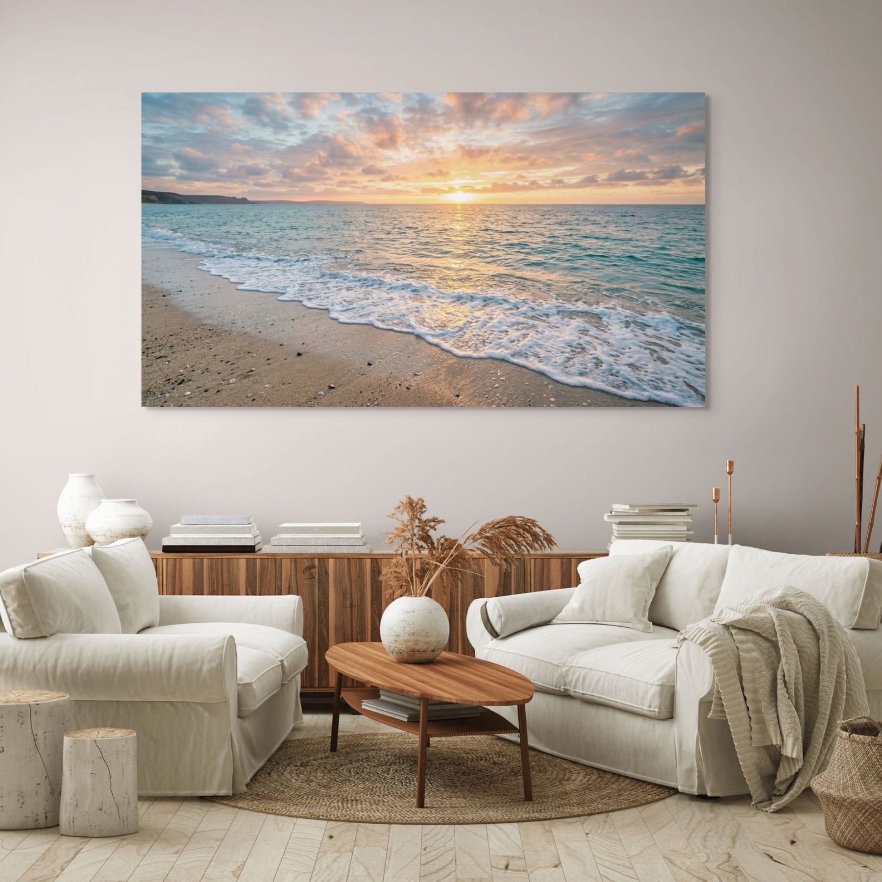Living room with a large beach sunset painting on the wall.