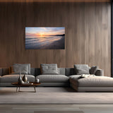 Modern living room with a large wall art displaying a beach sunset, gray sectional sofa, and wooden coffee table.