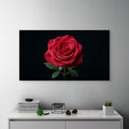 Large framed photograph of a red rose on a wall above a white cabinet with decorative items.