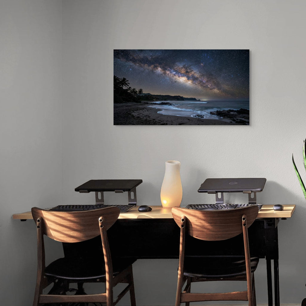 Modern office setup with a desk, chairs, and a large wall-mounted canvas of a beach scene.