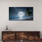 Framed artwork of a moonlit beach scene above a wooden console table.