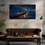 Living room with a large wall art of a pier and night sky, brown sofa, and wooden coffee table.