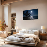 Modern bedroom with a large bed, nightstands, and a wall painting of a beach scene.