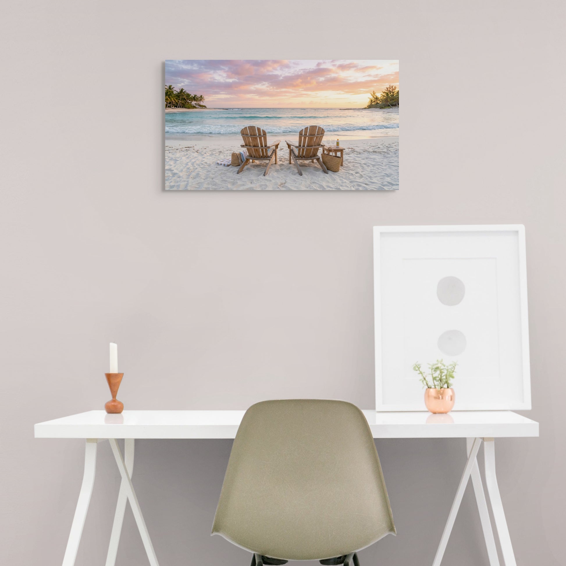 Beach scene painting above a desk with a chair and decorative items.