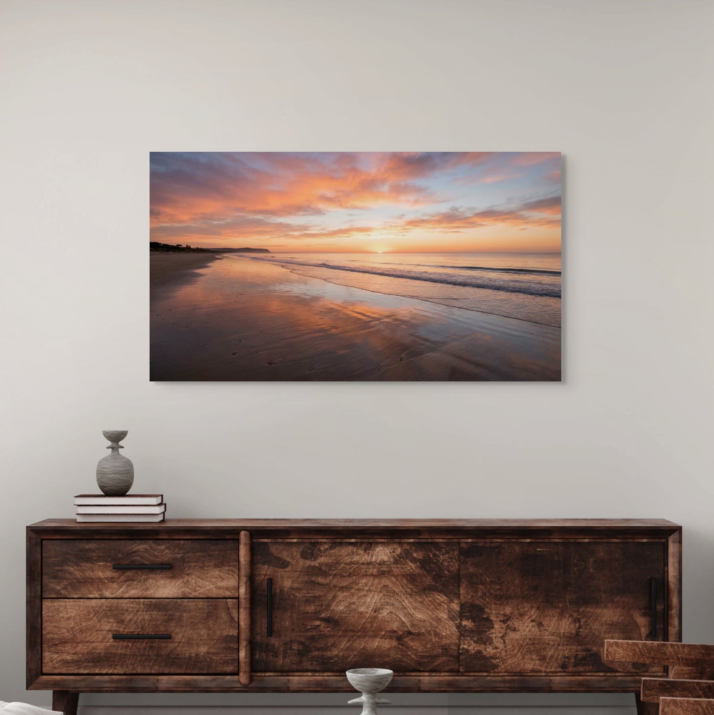 Sunset beach canvas print with glowing ocean waves over hallway console