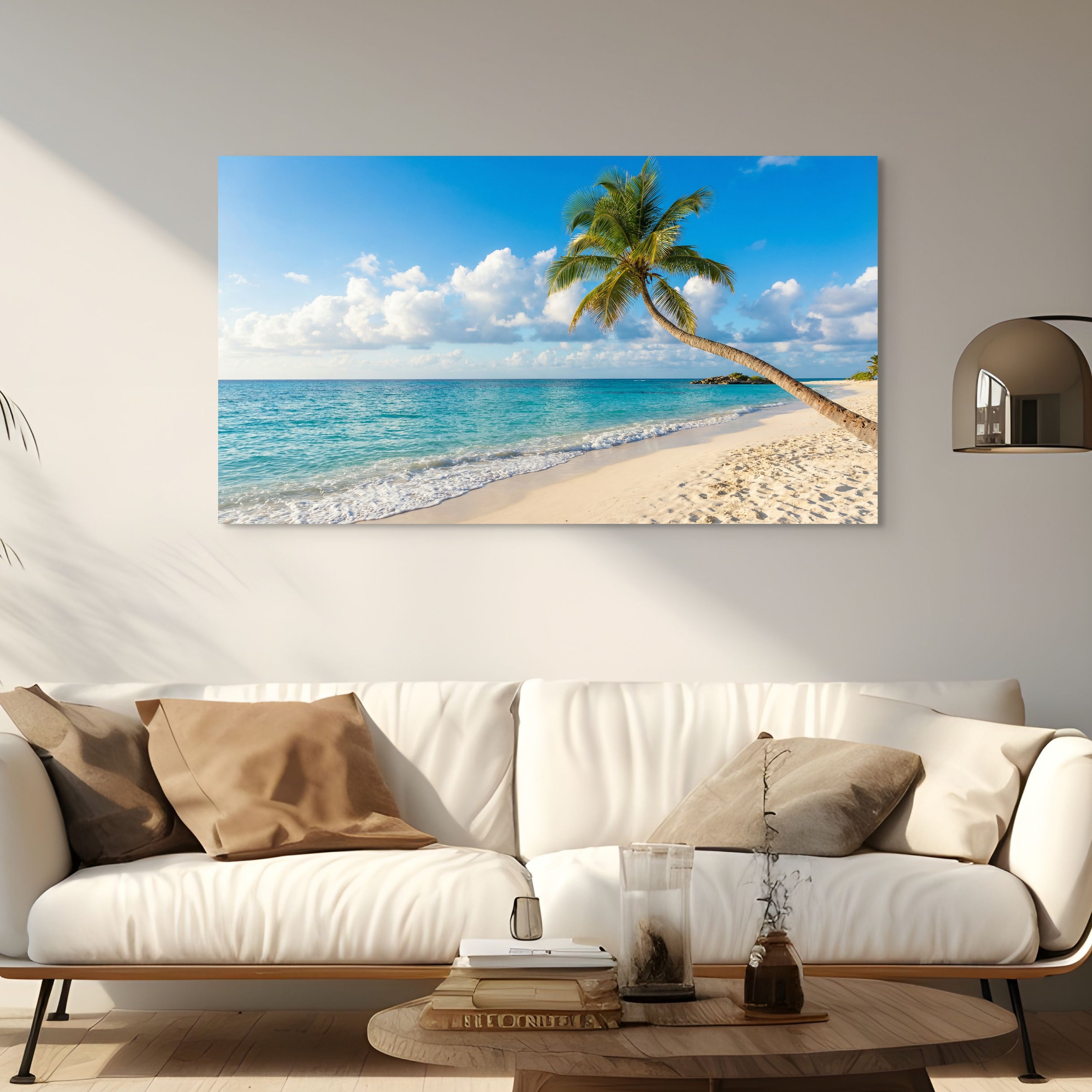 Beach scene with palm tree on wall above a white sofa in living room. Main image