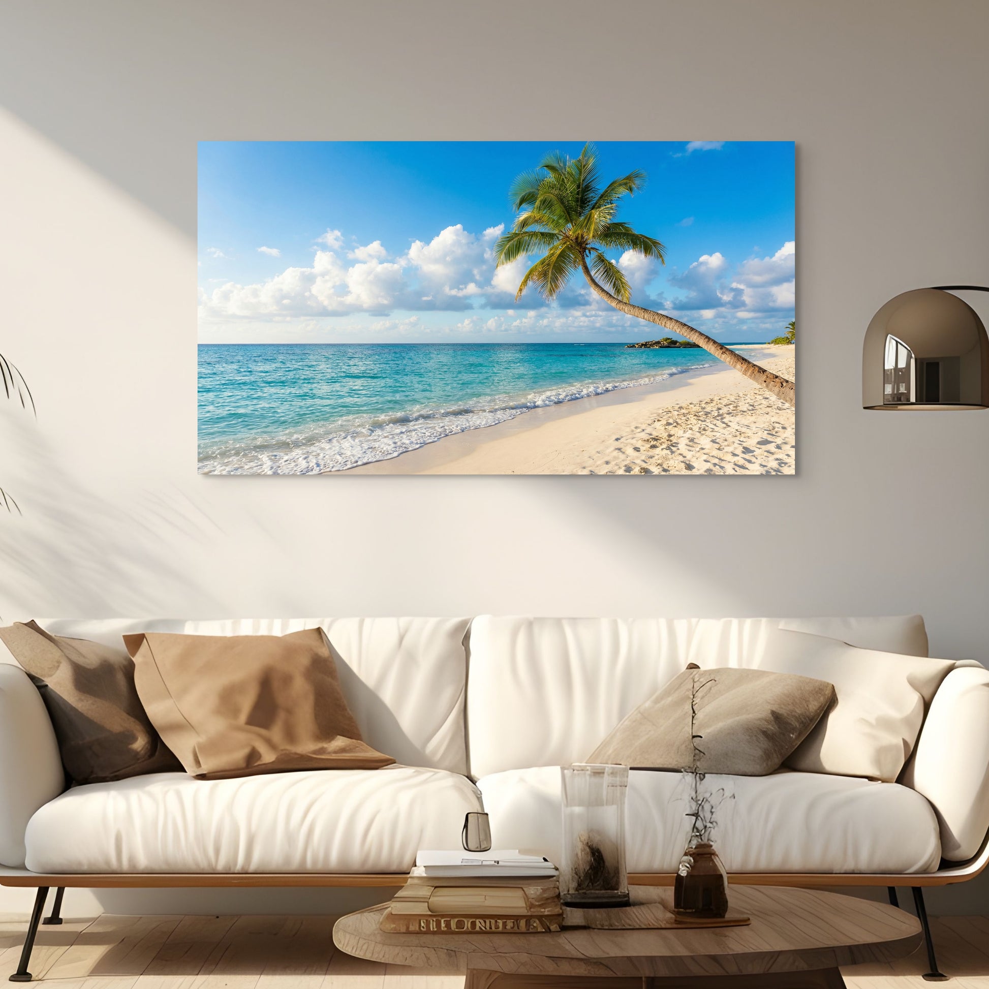 Beach scene with palm tree on wall above a white sofa in living room.