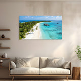 Beach scene painting above a white sofa in a living room