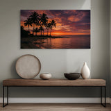 Tropical sunset beach canvas wall art with palm trees over table in hall.