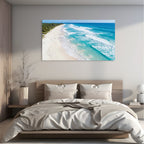 Aerial turquoise beach canvas wall art ocean waves view on modern bedroom wall.
