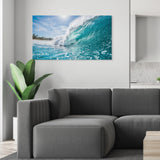 Living room with a gray sofa and a large canvas print of a wave on the wall.