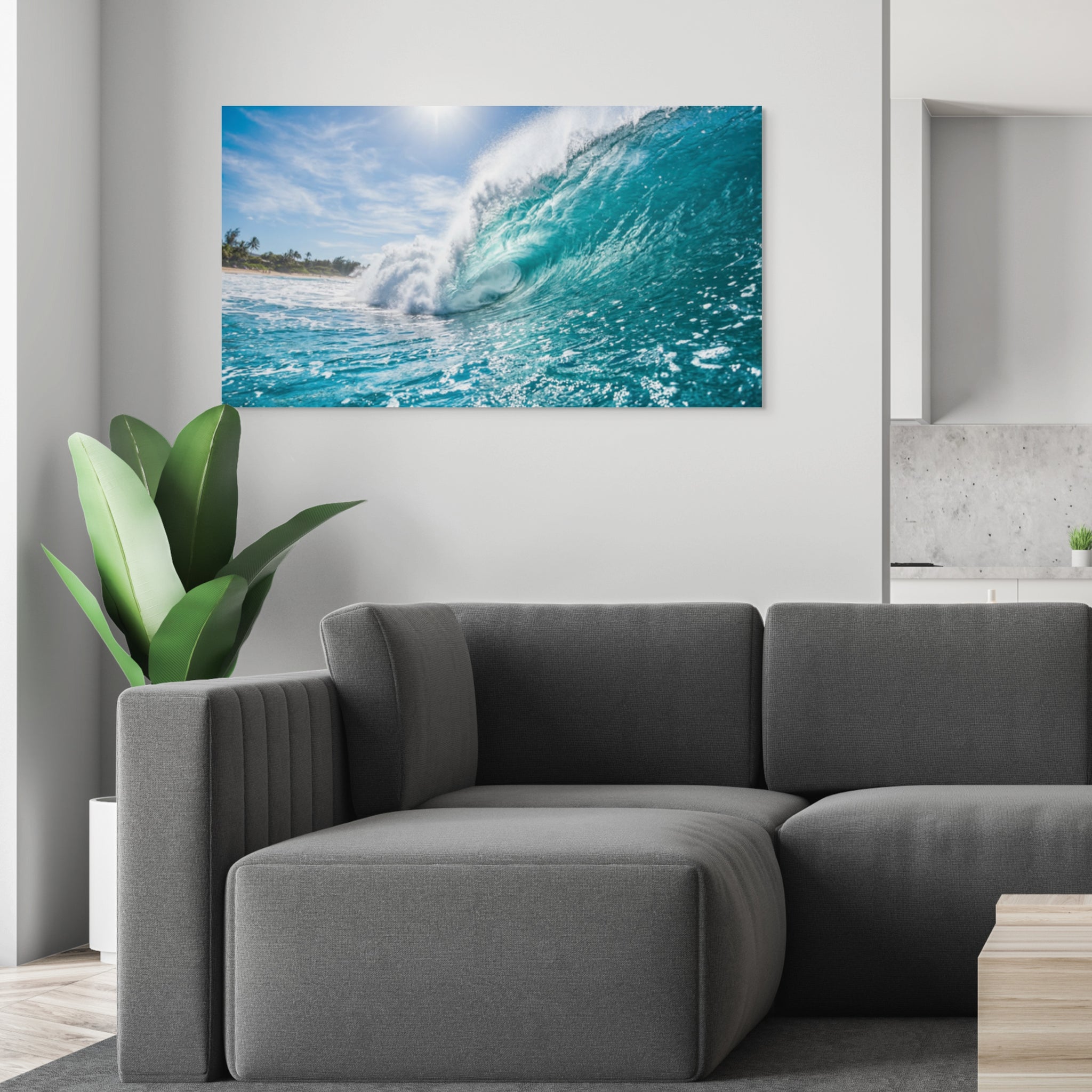 Living room with a gray sofa and a large canvas print of a wave on the wall.